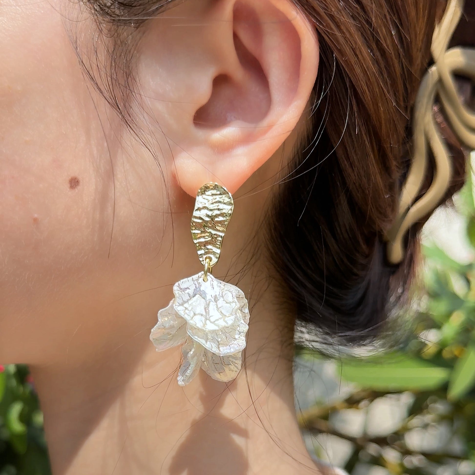 Romantic earrings with floral elements in French style